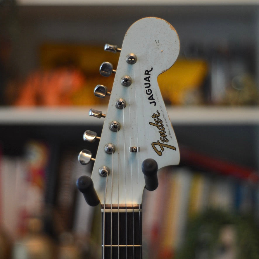 Fender Jaguar guitar headstock with blurred background