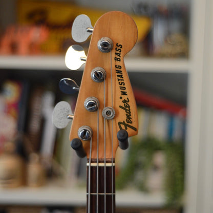 Fender Mustang Bass headstock with blurred background