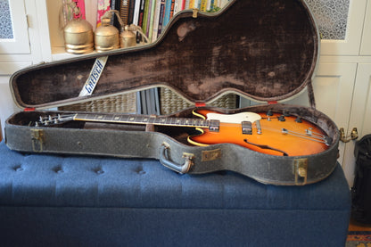 Shows a 1960s Epiphone Riviera in an old Gretsch case