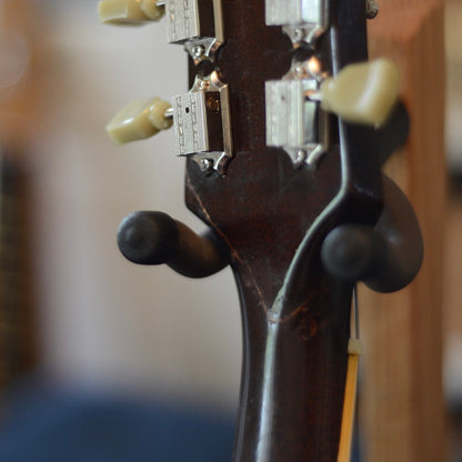 Shows the old headstock repair done to this 1967 Epiphone Riviera across the back of the headstock in a U shape